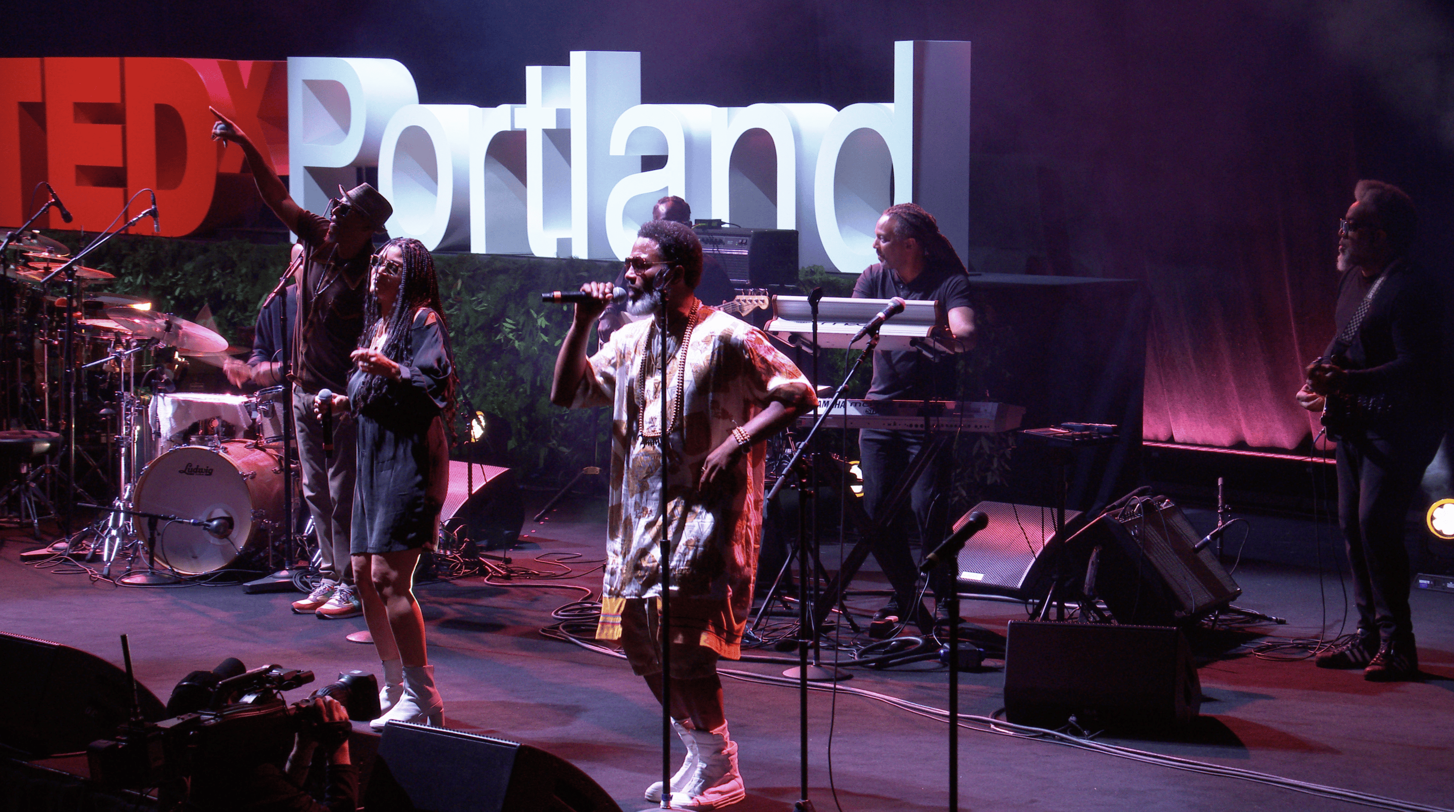 Musical performers on stage at the TEDx Portland 10th anniversary event
