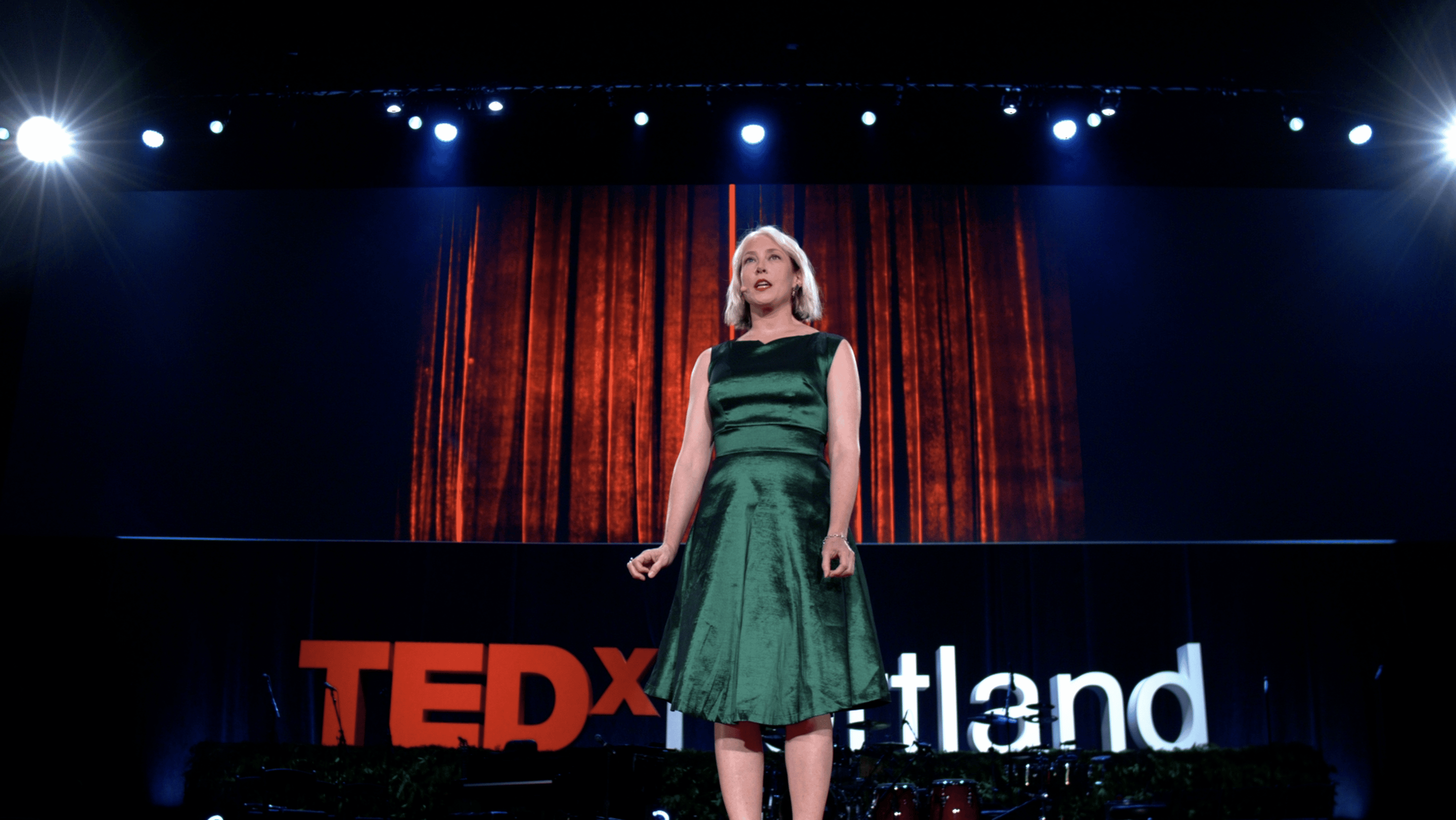 Woman presenting at the TEDx Portland 10th anniversary event